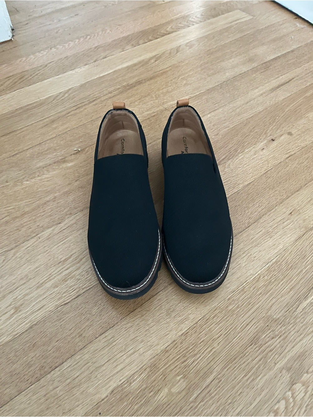 Women’s Comfortiva Black Slip-On Loafers with Tan Heel Pull